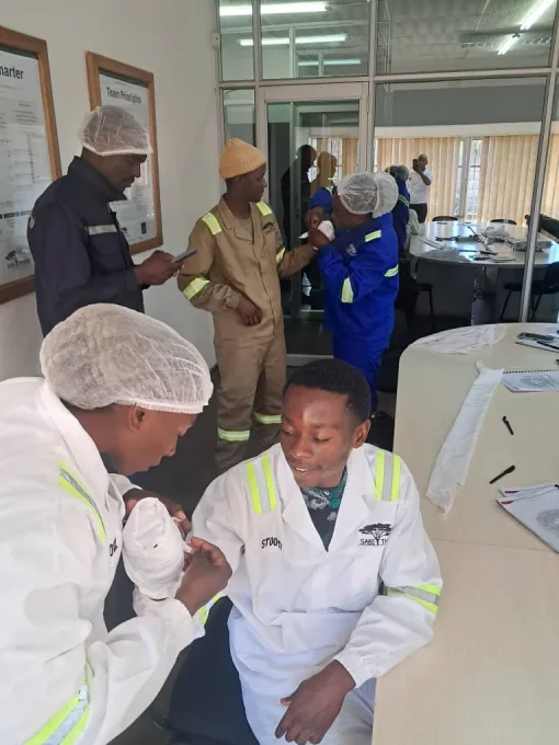 Participants practising first aid during a Lifeline First Aid training session.